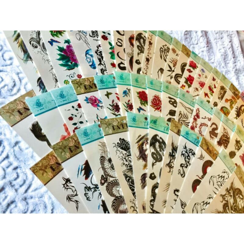 kit com 12 cartelas de tatuagens sortidas