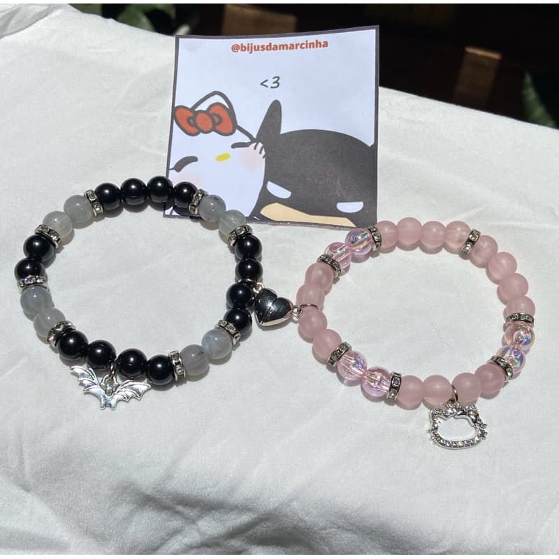 Pulseira Batman vs Hello Kitty com ima magnético
