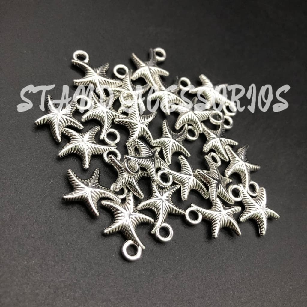 Pingente de Estrela do mar em metal com 20g aprox 20 peças Tam 15x12mm