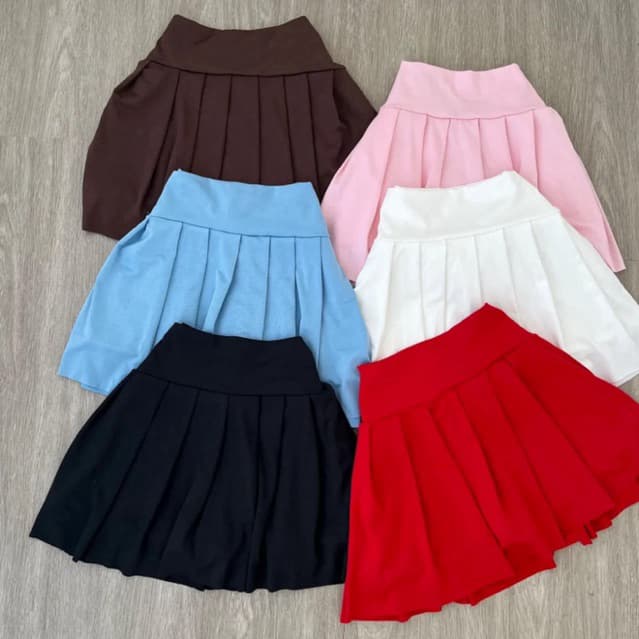 shorts saia plissada feminino rodada curta moda gringa tendência 2025 balada saia mini