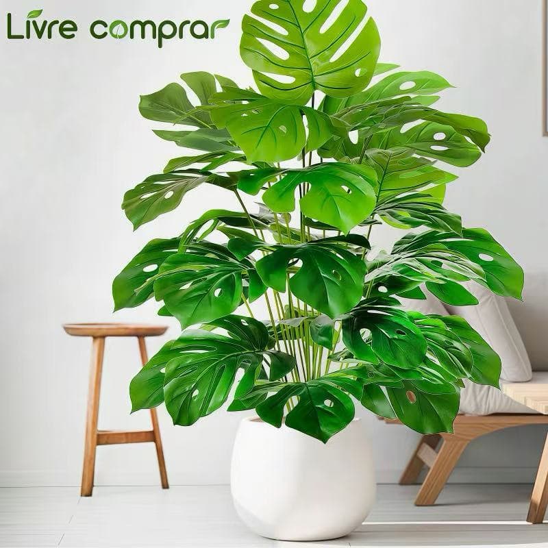 A planta artificial Monstera deliciosa tem 95 cm de altura e 24 folhas decorativas.