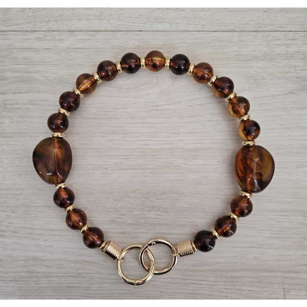 Alça para bolsa de resina com mosquetão articulado dourado