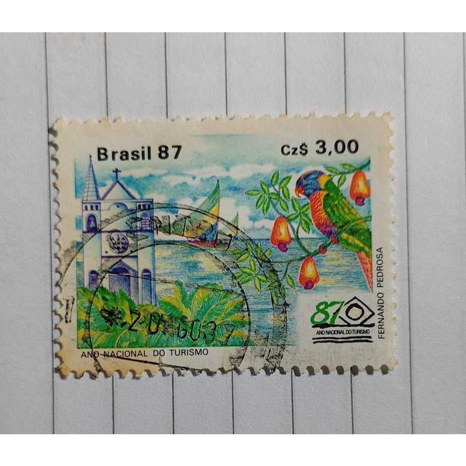 Selo Postal Brasil – Ano Nacional do Turismo (Arara e Igreja) – 1987