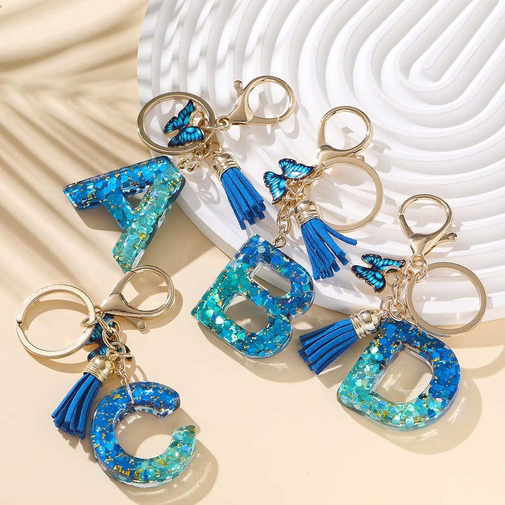 Resina 26 inglês carta chaveiro carta chaveiro cristal azul real borla borboleta pingente atacado